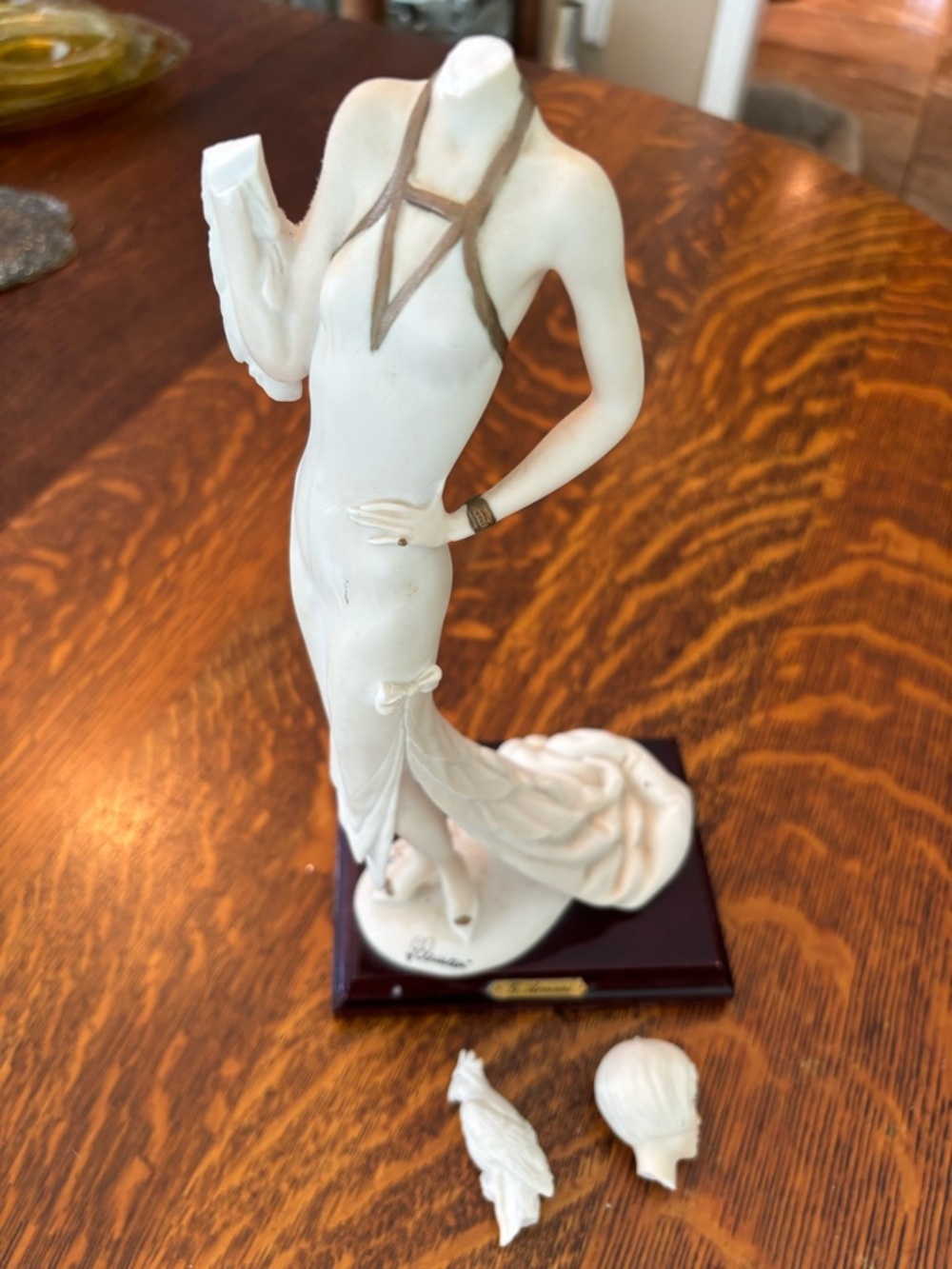 Damaged Giuseppe Armani "Lady with Parrot" figurine, Florence, Italy, in 1987